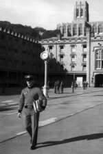 Cadet C. Robert Arvin walks through the Central Area on his way to a class. The numerals "65" worn on his jacket were earned as a member of the plebe wrestling squad and are West Point's freshman letter. The Cadet Chapel looms in the background. Cadet C. Robert Arvin Plebe Year