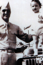 Carl with Bob on hood of Jeep